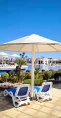 Tropical oasis: resort pool under the scorching sun
