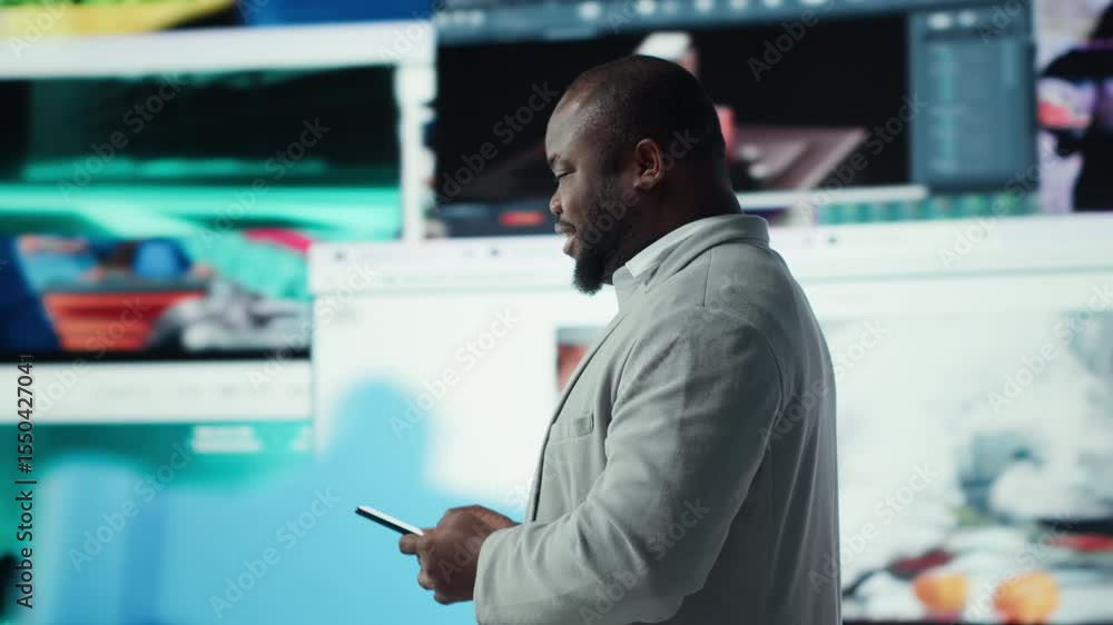 Poster smiling man using mobile phone surrounded by video recommendations while browsing streaming services