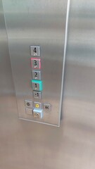 Remote Control Panel in an Elevator Displaying Selected Floors and Status Indicators