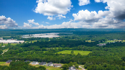 aerial shot of vast miles of lush green trees and the ALDI distribution center at the Nashville...
