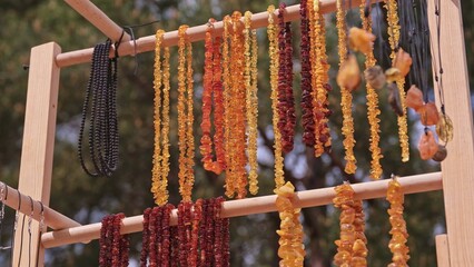 Valuable Jewellery Natural Amber Necklaces Sold on Outdoor Market Stand at Baltic Seaside Resort in Poland