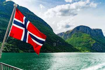 Norwegian flag flying on a ferry in Naeroyfjord