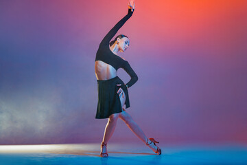 Latin Female Dancer in Black Performing Artistic Graceful Pose Studio Modern Latin American Dance