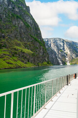 Blue skies and vast Naeroyfjord scenery from a ferry