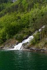Spring waterfall cascading into Naeroyfjord in Norway