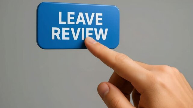 A hand presses a floating blue button labeled leave review against gray wall. Concept of encouraging customer feedback.