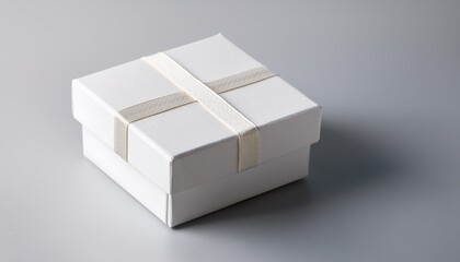 white square gift box with lid on plain background