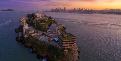 Alcatraz Island, USA, at dusk. The former prison is a popular tourist destination. Visitors explore...