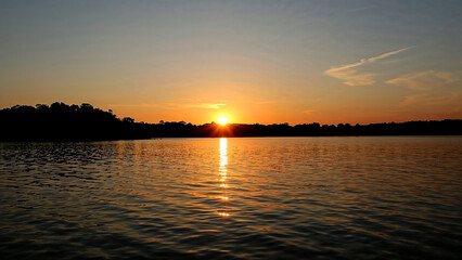 Golden hour serenity over a tranquil lake