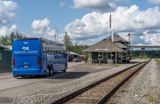 Princess Cruises tour bus arriving at the town of Nenana near the historic railroad station that now serves as a museum, Nenana, Alaska