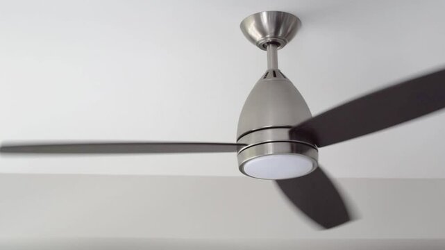 Simple modern ceiling fan rotating, static view