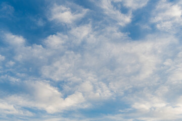 Sky clouds background. Blue Heaven and white clouds. White cloudy Heaven with soft sun light....