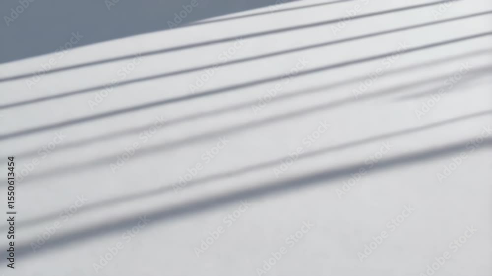 Poster abstract shot of parallel shadows falling diagonally on a white textured surface creating a clean an