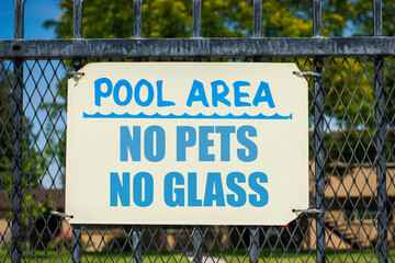 Pool area no pets or glass  sign