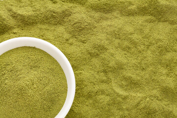 Organic dried moringa powder in the bowl - Moringa oleifera
