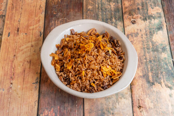 Fried rice is an iconic dish of Chinese cuisine, popularized in the West for its balanced flavor, versatility, and quick preparation