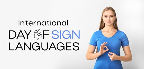 Young deaf mute woman on light background. Banner for International Day of Sign Languages