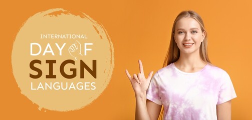 Young deaf mute woman on orange background. Banner for International Day of Sign Languages