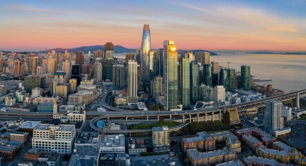 Aerial view of San Francisco's skyline at sunset in California, USA. The Salesforce Tower and Bay...