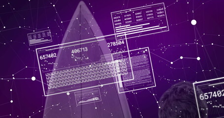 Viewing IT professional analyzing holographic data panels in cyber network, with numeric readouts