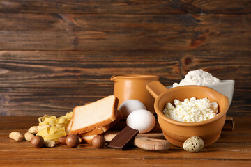 Different products on wooden table. Food Allergy Awareness Month