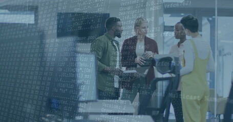 Discussing code overlay, coworkers holding coffee mugs and tablet near treadmill console in office