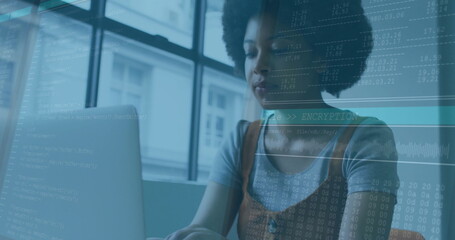 Typing woman developer coding at workspace desk by window, with laptop and code overlays
