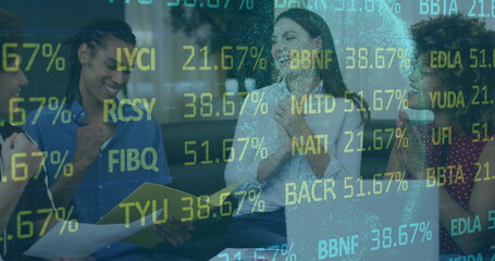 Celebrating business team sitting in modern office lounge with yellow folder and stock data overlay