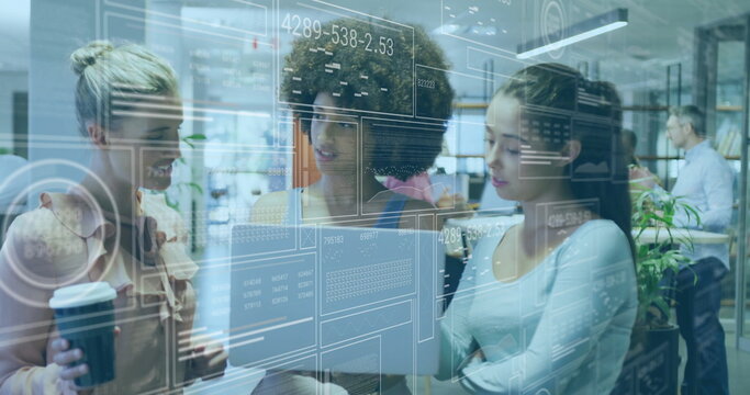 Collaborating professionals reviewing laptop data in office with coffee cup and analytics overlay