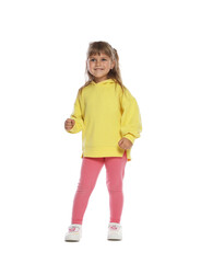 Happy little girl dancing on white background