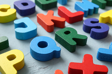 Many English letters on blue background, closeup