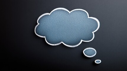 Thought bubble illustration with textured blue surface on dark background, perfect for creative concepts and ideas in digital or print media, showcasing imagination and conceptual thinking.
