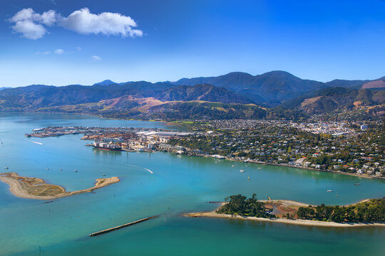 Nelson, New Zealand. Aerial view of harbour, city, suburbs, port, hills, with 'The Cut', entrance to Nelson Haven from Tasman Bay between the Boulder Bank and Haulashore Island.