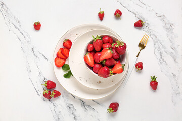 Bowl with fresh ripe strawberries on white background