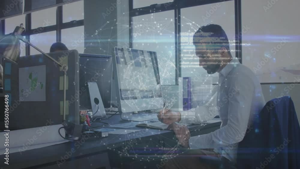 Aufkleber man typing keyboard at open-plan desk, initiating holographic technology sphere while studying data