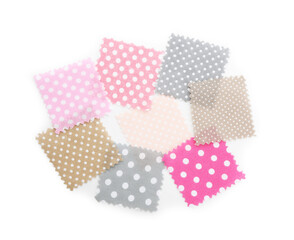 Samples of fabrics with polka dot pattern isolated on white, top view