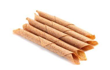 Delicious fruit leather rolls on white background