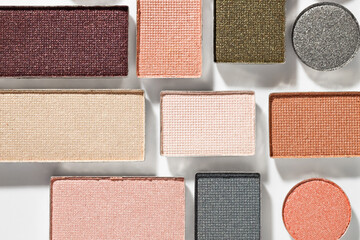 Beautiful eyeshadow refill pans on white background, flat lay