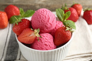 Tasty sorbet with strawberries and mint served on wooden table, closeup