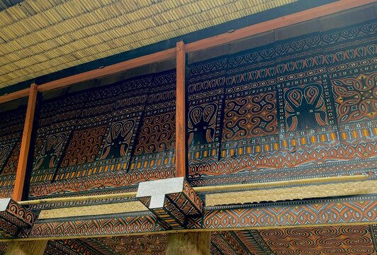 Colorful Torajan ethnic designs and patterns on traditional tongkonan houses in Toraja, South Sulawesi.