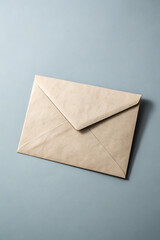 A vintage, creamcolored envelope on a light blue background