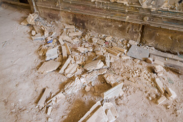 An Abandoned Room Filled with Debris and a Dusty Floor that tells a Silent Story