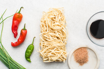 Overhead view of ingredients for making mongolian beef noodles, mise en place of ingredients for...
