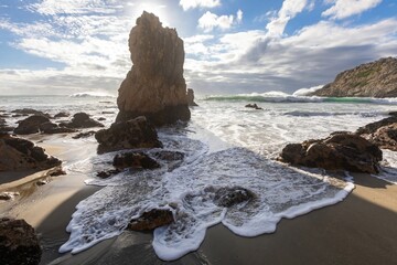 Waves crash against the rocky shore of Point Reyes, California, USA., USA. The ocean's power shapes...