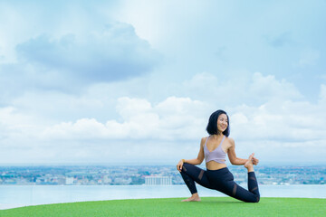 yoga, Asian woman wearing yoga clothes practicing yoga, Asia group of women exercising healthy lifestyle in outdoor fitness studio. swimming pool. Sport activity, gymnastics or ballet dancing class.