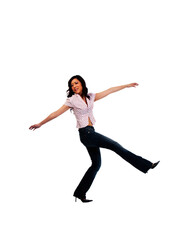 Obraz premium Young Asian American Woman In Jeans Kicking Up Leg