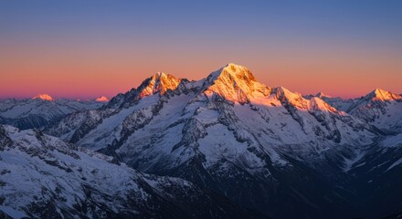 Majestic Sunset over Snowy Mountain Peaks