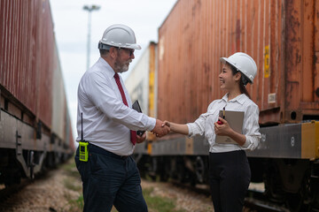 Engineer manager and a secretary working together railway track during inspection or routine...