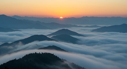 Mountain Peaks Emerging From Morning Mist at Sunrise