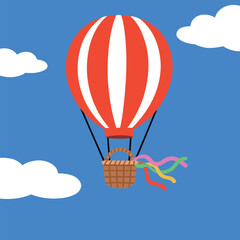 Obraz premium Hot Air Balloon Floating in Blue Sky with Clouds